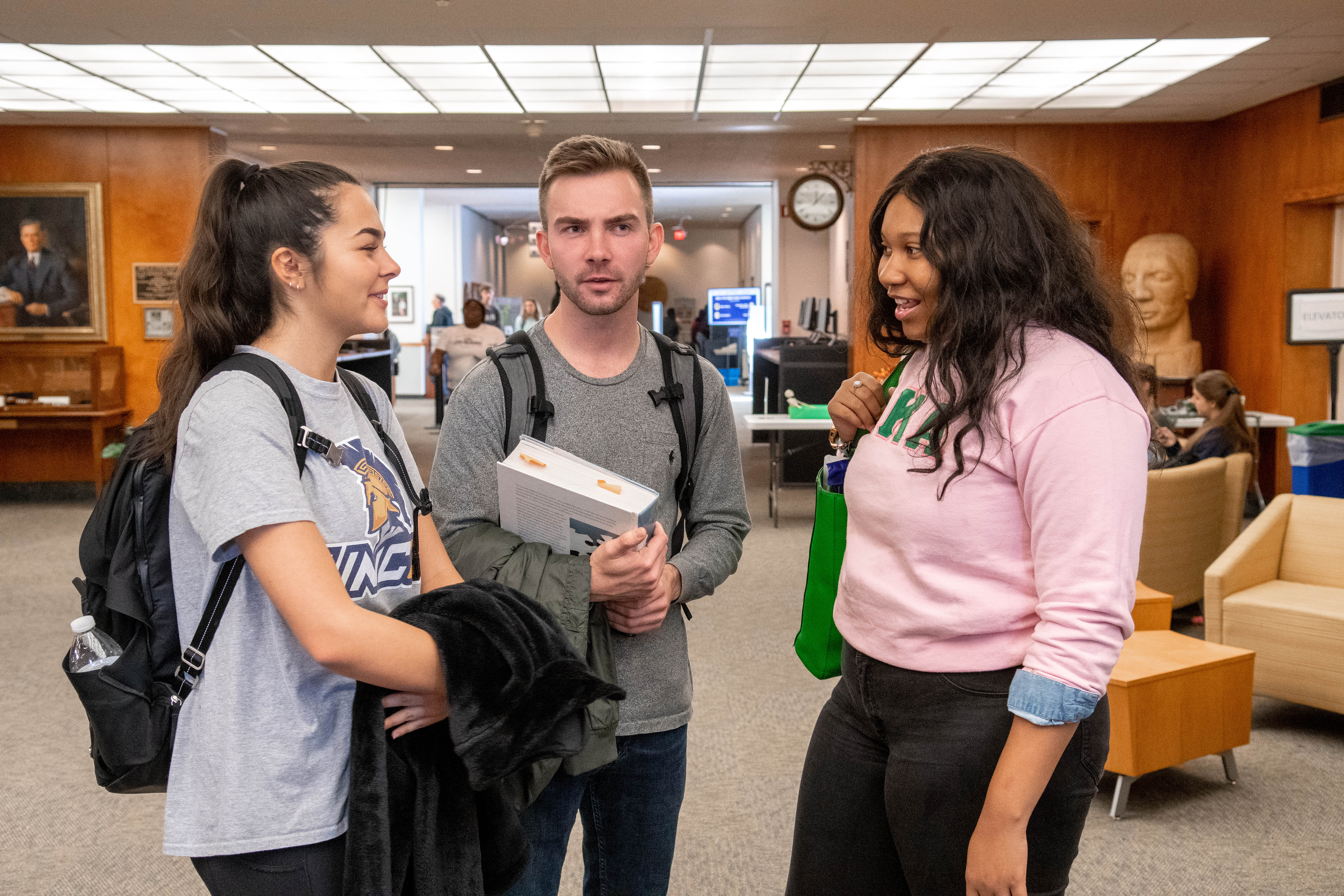 Students conversing in the Jackson Library.