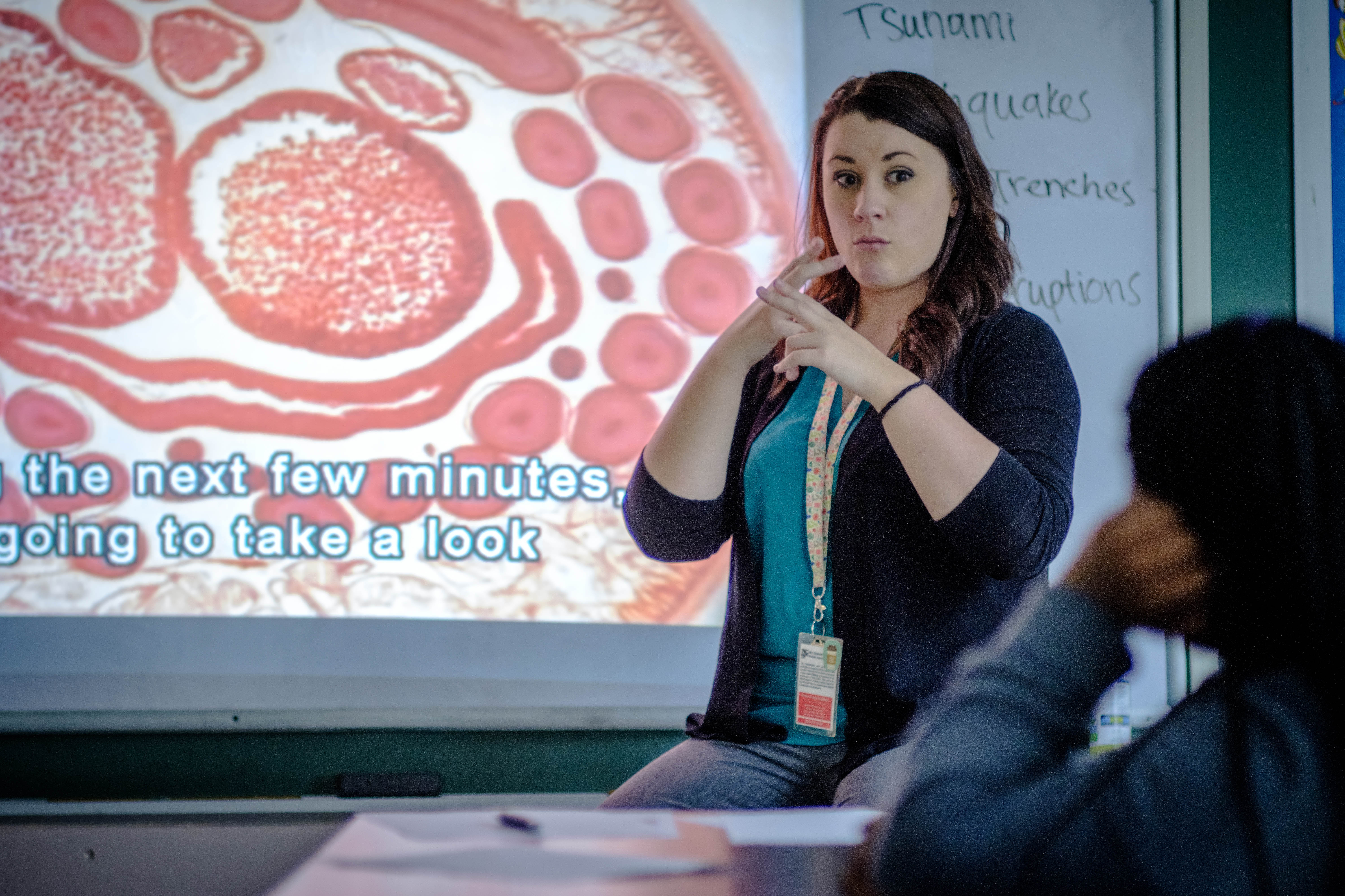 Michaela Williams, a graduate of UNCG's Professions in Deafness program teaches at the Eastern NC School for the Deaf, using American Sign Language.