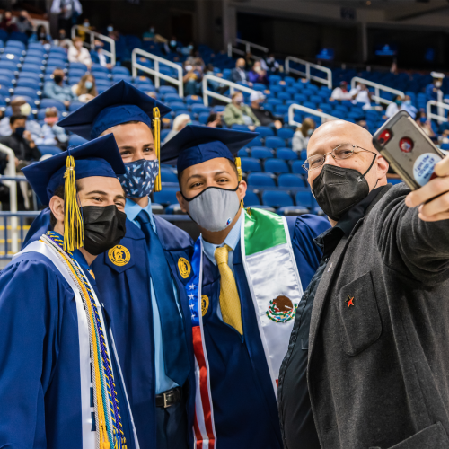2021 commencement graduates pose for a selfie