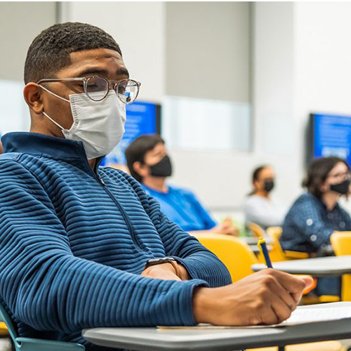 Students wearing masks in a classroom setting