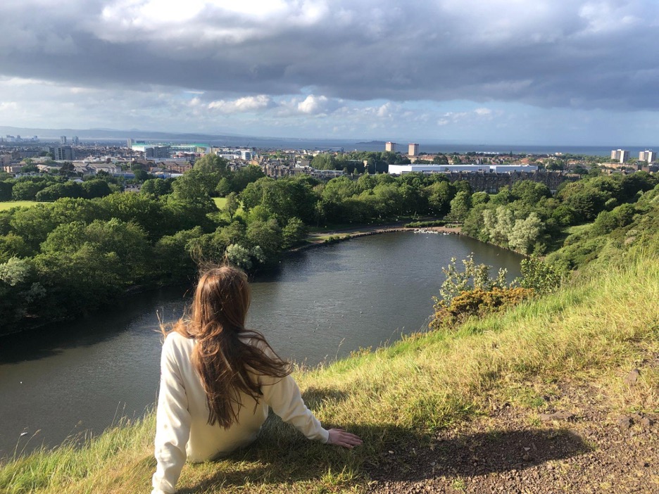 Hannah Ward takes in the view on top of a Scottish cliff during her summer study abroad session.