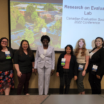 Dr. Ayoo and ERM graduate students pose for a group photo at the Canadian Evaluation Society 2022 Conferece