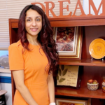CED alumna Sweety Patel poses for a photo in her office