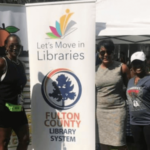 Michelle Bennett-Copeland, an Atlanta area librarian and Christy Dyson, created a banner displaying Fulton County Library System’s collaboration with Dr. Noah Lenstra’s initiative. As part of their summer reading club kick-off, the two shared the initiative with the Mayor of Atlanta, Keisha Lance Bottoms on May 30, 2019.