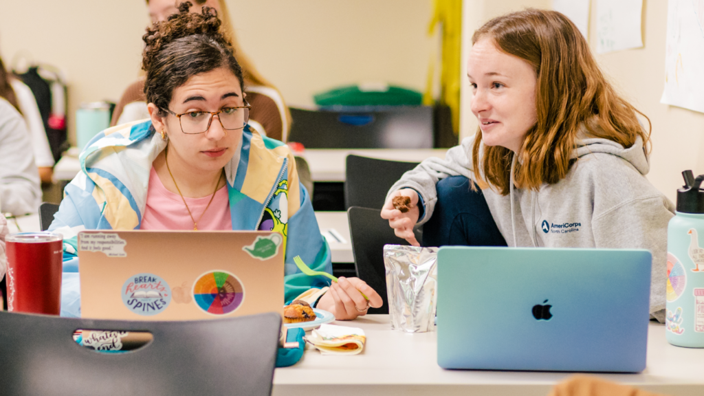 Two students in a counseling master's class work together