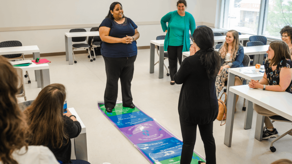 Students work to resolve a conflict on a mat