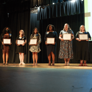 Kenyona Bethea, far left, stands with other honorees at the Guilford County Schools award ceremony