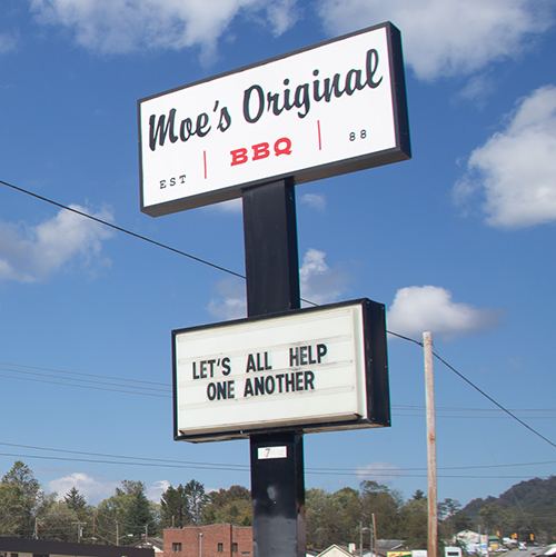 Restaurant sign urging people to help each other