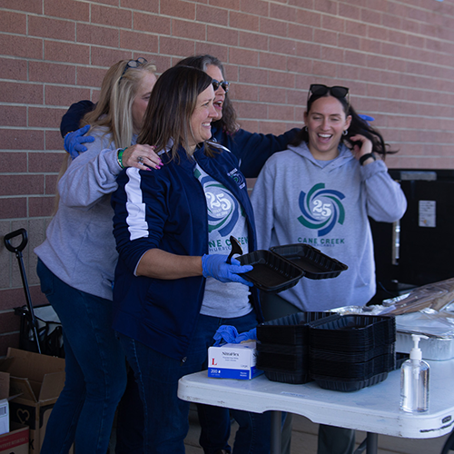 Staff at Cane Creek Middle School work a community event