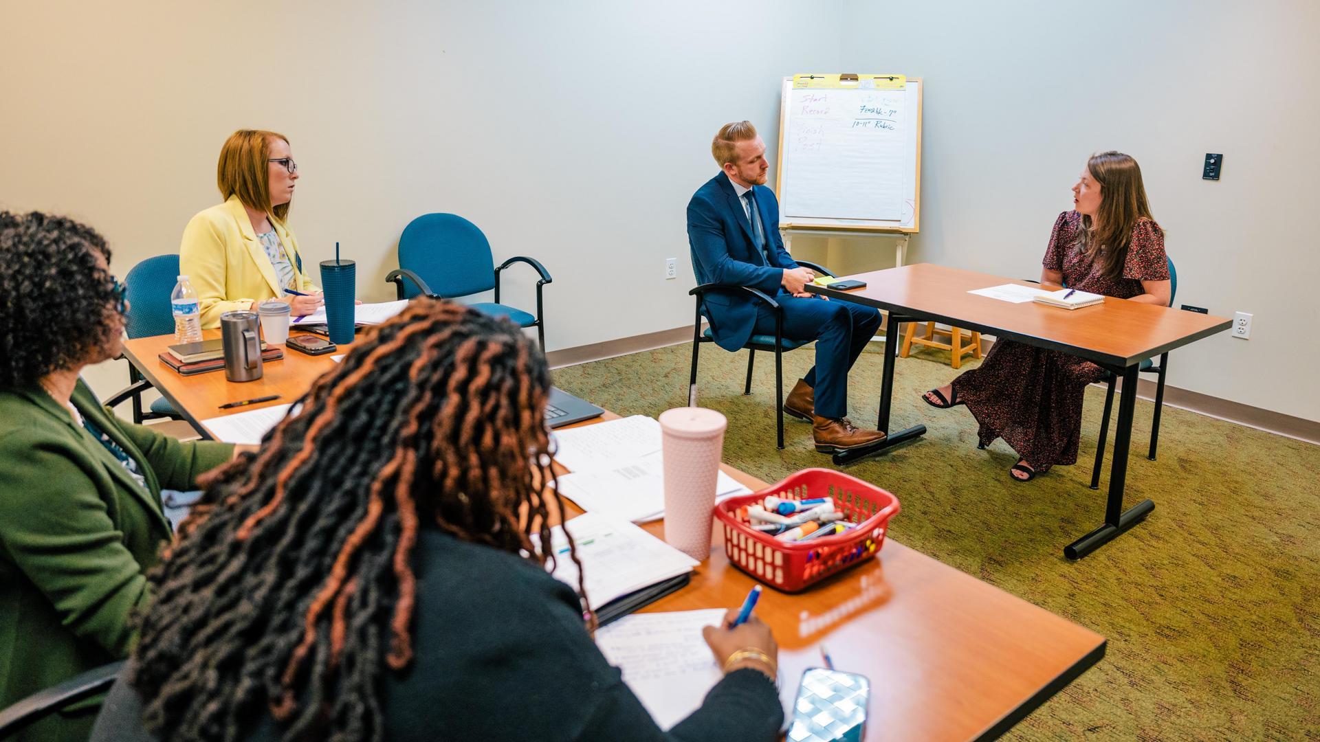 Education students in mock scenarios they'll face in the workplace.