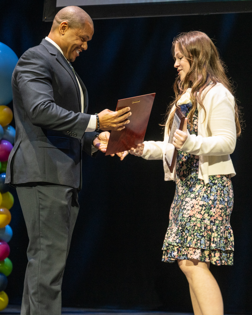 Madison Magyar accepts her Rookie Teacher of the Year award at the GCS awards celebration