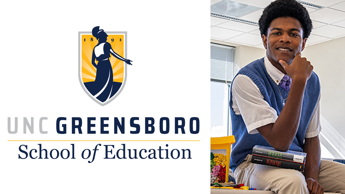 Malcolm Jones, UNCG's 2026 Student Teacher of the Year, sits on a classroom desk with a hand on his chin