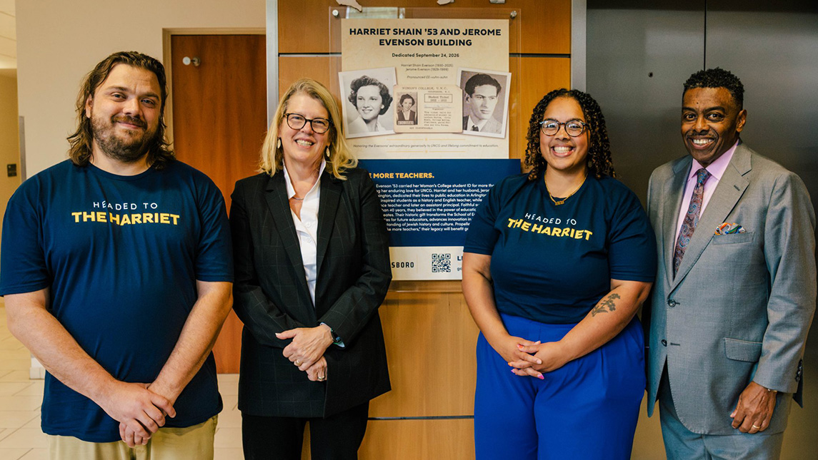 Evenson Scholar Allen Johnson, Betsey Wildhack, Evenson Scholar Cierra Murphy-Higgs ’16 MS, Chancellor Franklin D. Gilliam, Jr. stand beside a plaque honoring Harriet and Jerome Evenson