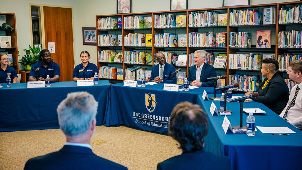 North Carolina Governor Josh Stein speaks during a roundtable with UNCG education students and Guilford County Schools teachers in a school library.